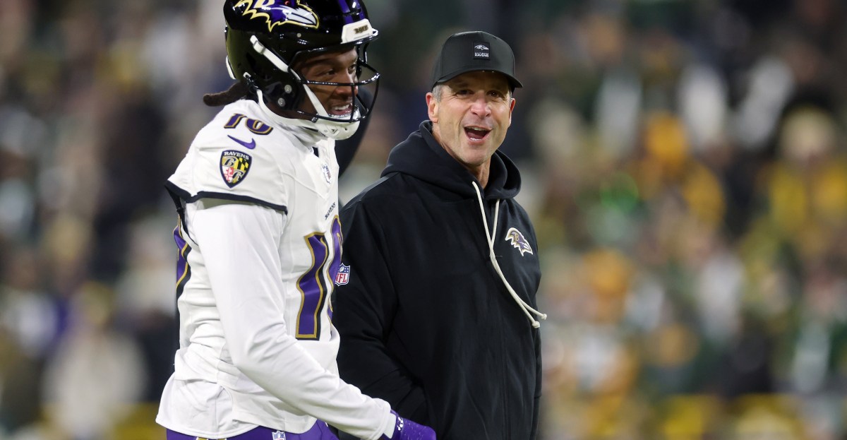 Jon Harbaugh watching film on Titans Cam Ward