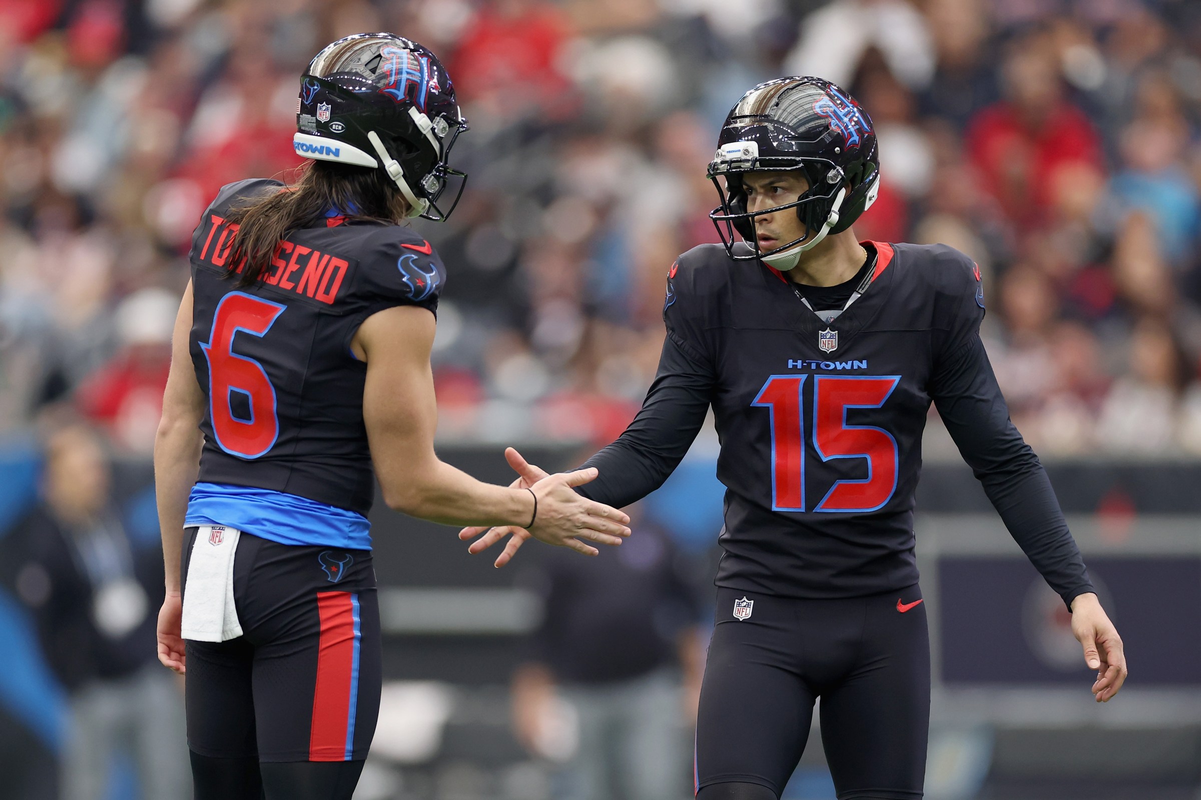 HOUSTON, TEXAS - JANUARY 04: Tommy Townsend #6 and Ka’imi Fairbairn #15 of the Houston Texans react after scoring a field goal during the first quarter of the game against the Indianapolis Colts at NRG Stadium on January 04, 2026 in Houston, Texas. (Photo by Tim Warner/Getty Images)