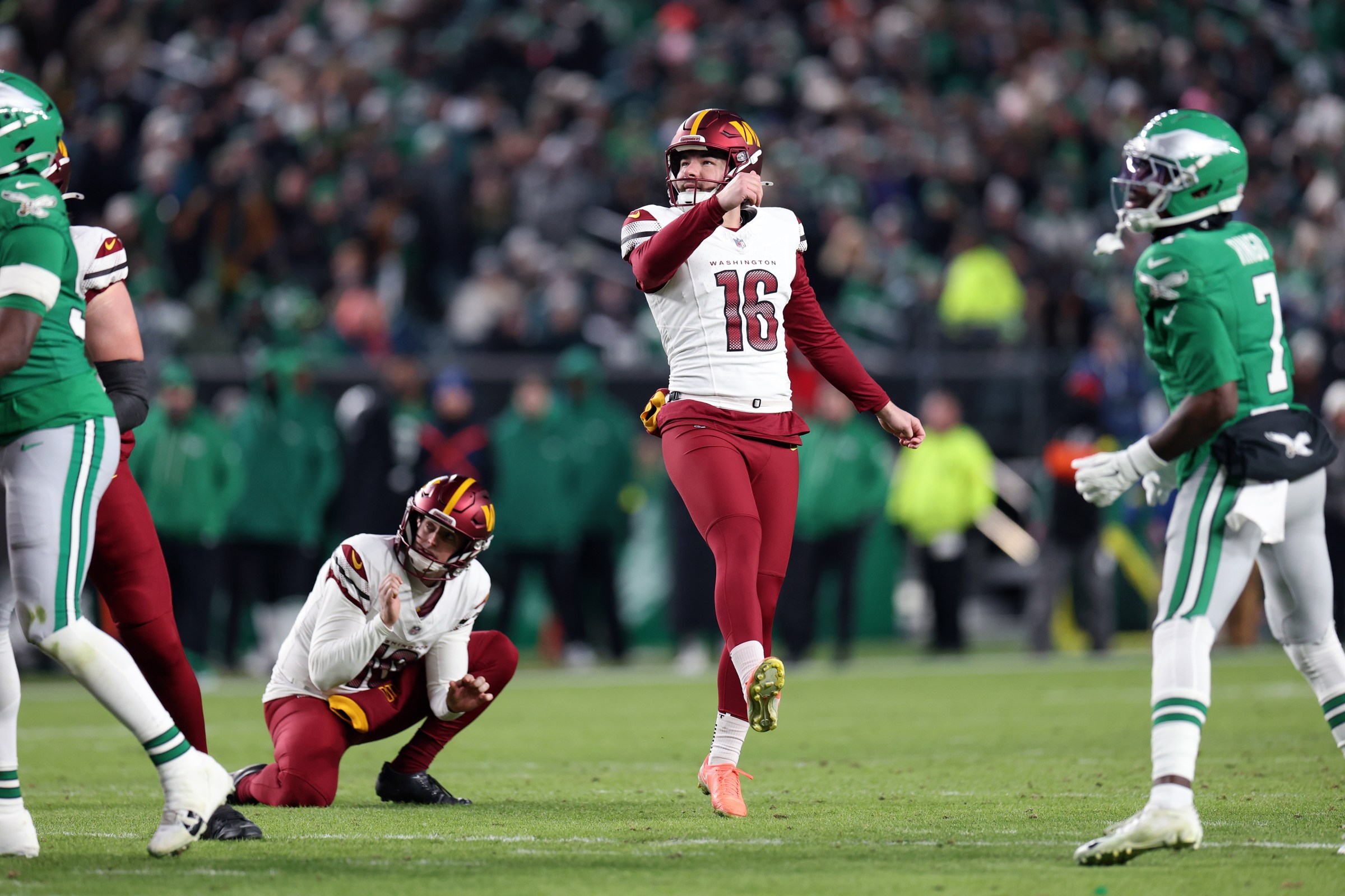 PHILADELPHIA, PENNSYLVANIA - JANUARY 04: Jake Moody #16 of the Washington Commanders kicks a field goal during the second quarter of the game against the Philadelphia Eagles at Lincoln Financial Field on January 04, 2026 in Philadelphia, Pennsylvania. (Photo by Emilee Chinn/Getty Images)