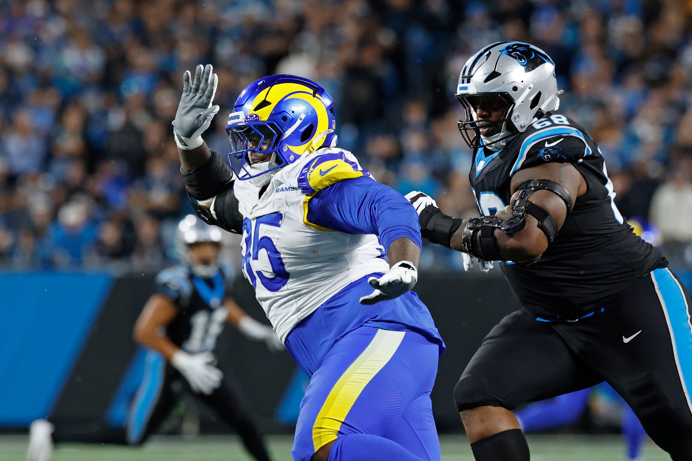 CHARLOTTE, NC - JANUARY 10: Los Angeles Rams defensive tackle Poona Ford (95) rushes on defense during the NFC Wildcard playoff game against the Carolina Panthers on January 10, 2026 at Bank of America Stadium in Charlotte, North Carolina. (Photo by Joe Robbins/Icon Sportswire via Getty Images)