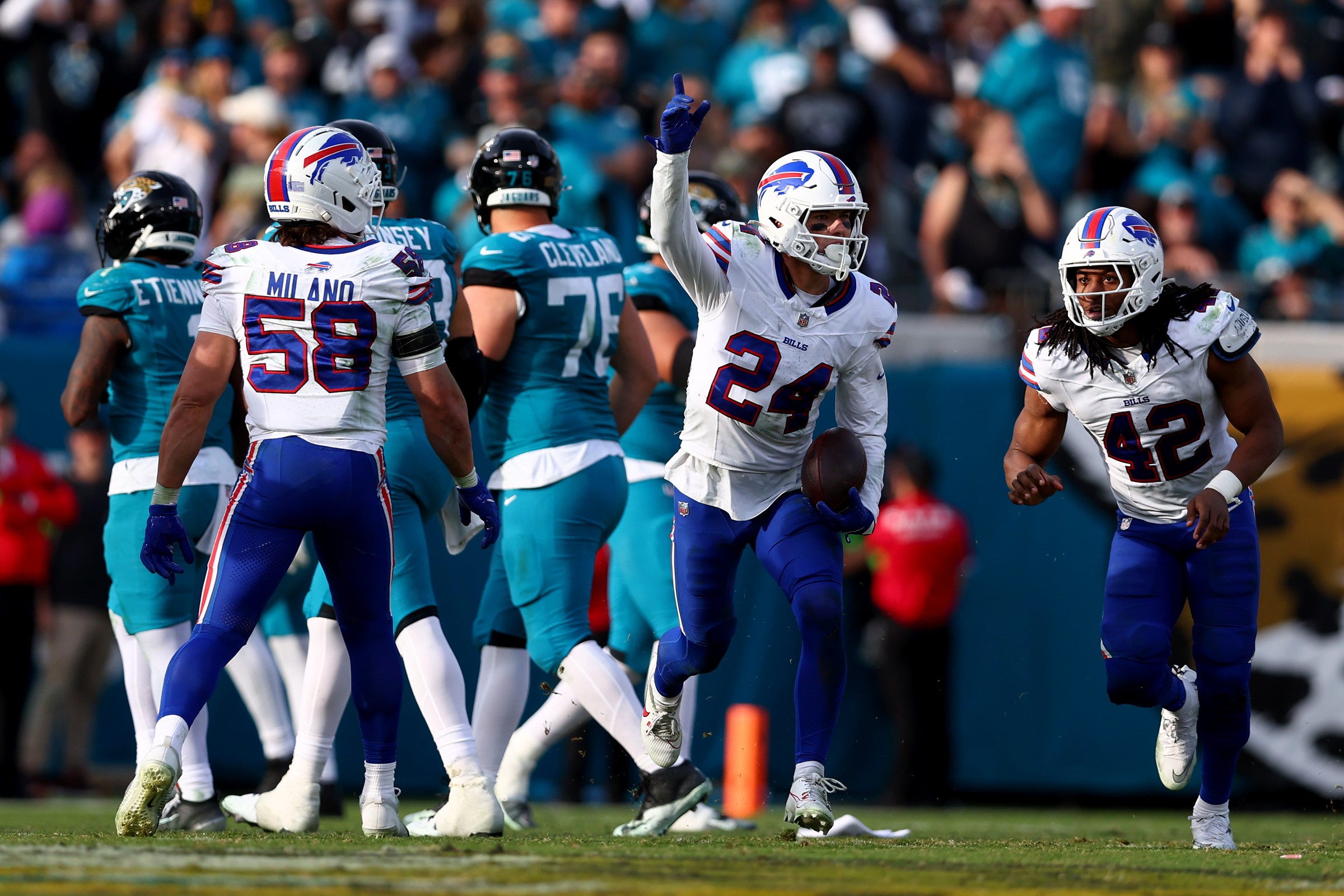 JACKSONVILLE, FLORIDA - JANUARY 11: Cole Bishop #24 of the Buffalo Bills celebrates with teammates after intercepting a pass during the fourth quarter against the Jacksonville Jaguars in the AFC Wild Card Playoff game at EverBank Stadium on January 11, 2026 in Jacksonville, Florida. (Photo by Megan Briggs/Getty Images)