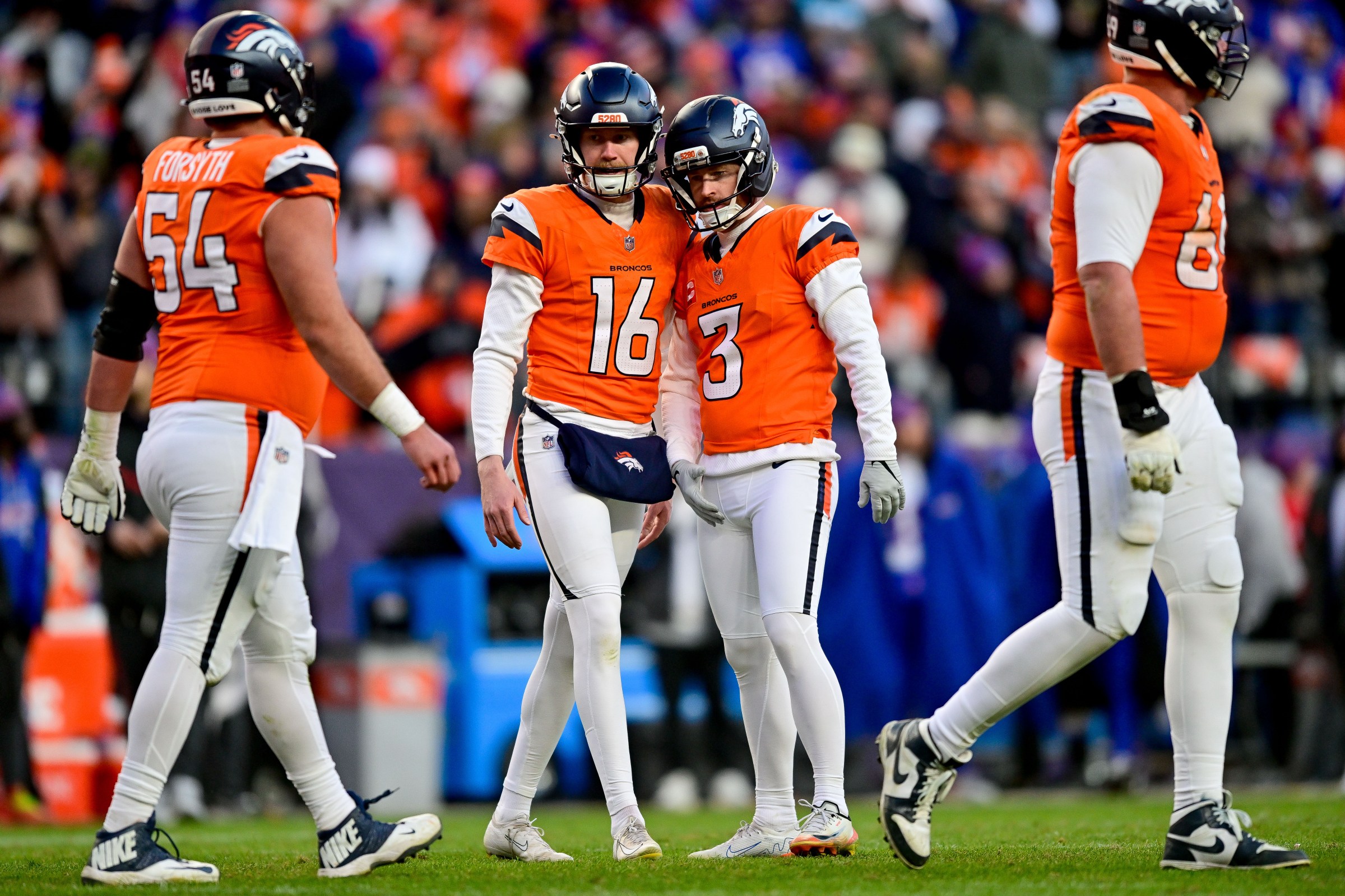 DENVER, CO - JANUARY 17: Denver Broncos place kicker Wil Lutz (3) celebrates with punter Jeremy Crawshaw (16) after a third quarter field goal against the Buffalo Bills in the AFC Divisional Round game at Empower Field at Mile High on January 17, 2026 in Denver, Colorado. (Photo by Dustin Bradford/Icon Sportswire via Getty Images)