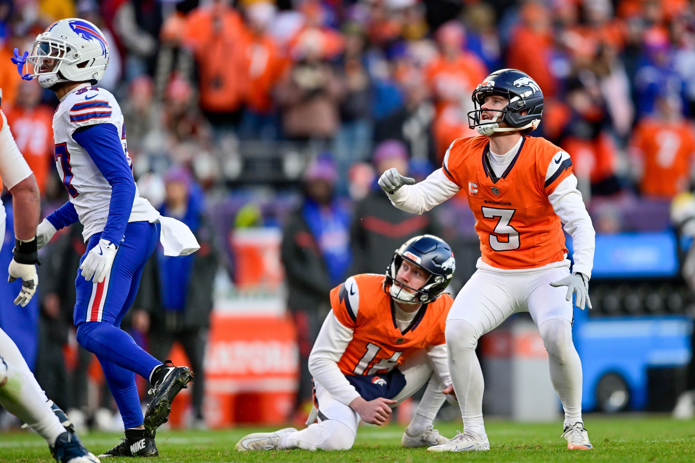 DENVER, CO - JANUARY 17: Denver Broncos place kicker Wil Lutz (3) watches with punter Jeremy Crawshaw (16) after a third quarter field goal against the Buffalo Bills in the AFC Divisional Round game at Empower Field at Mile High on January 17, 2026 in Denver, Colorado. (Photo by Dustin Bradford/Icon Sportswire via Getty Images)