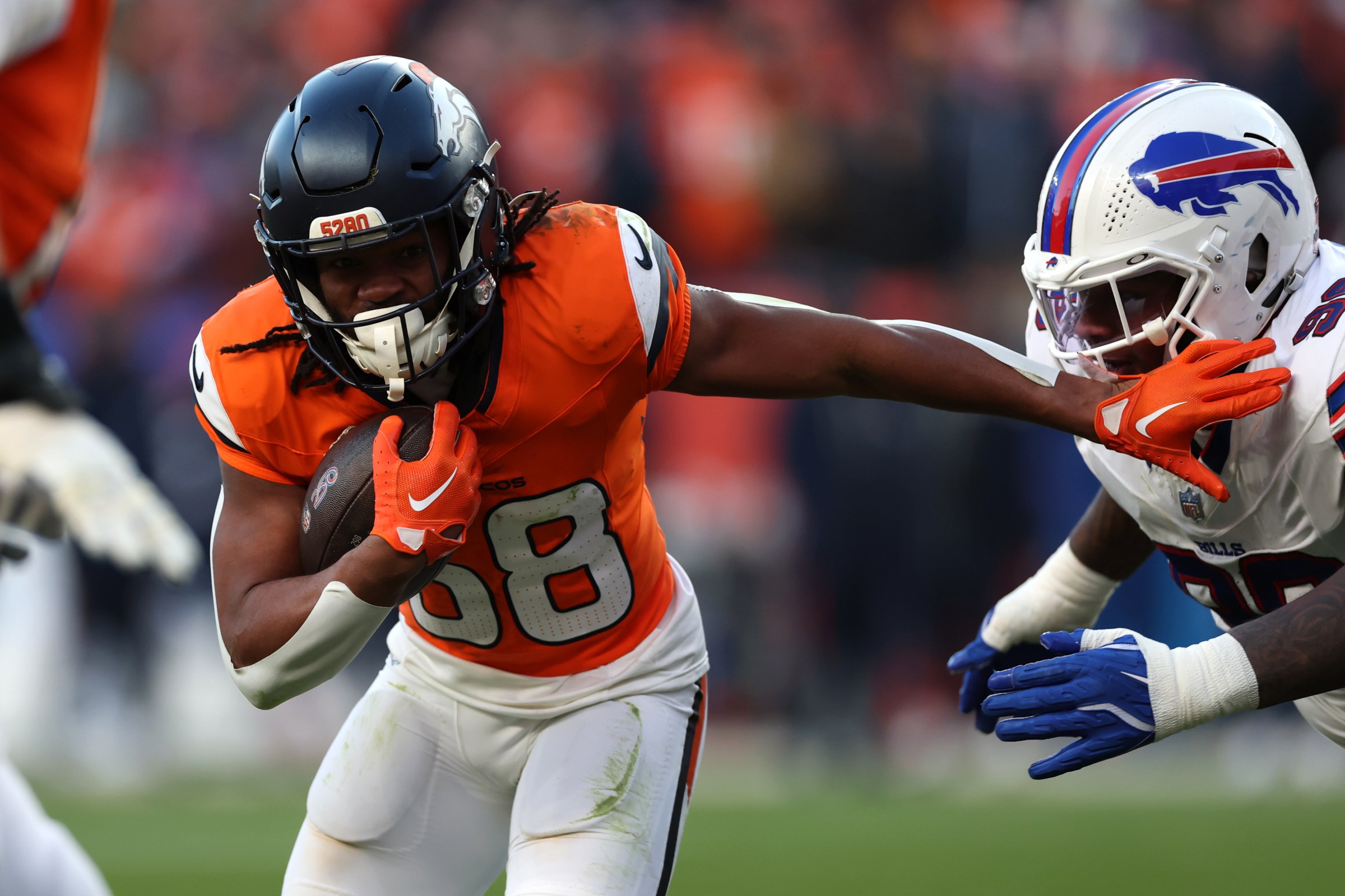 DENVER, COLORADO - JANUARY 17: Jaleel McLaughlin #38 of the Denver Broncos runs the ball against the Buffalo Bills during the third quarter in the AFC Divisional Playoff game at Empower Field At Mile High on January 17, 2026 in Denver, Colorado. (Photo by Matthew Stockman/Getty Images)