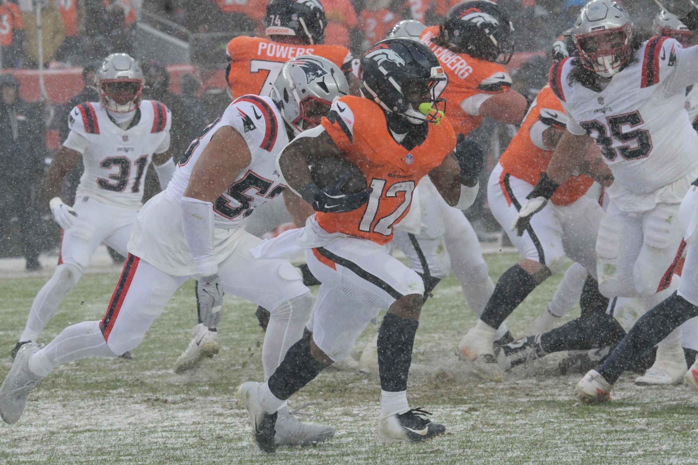 DENVER, CO - JANUARY 25 : RJ Harvey (12) of the Denver Broncos rush against New England Patriots defense during 4th quarter of AFC Championship Game at Empower Field at Mile High in Denver, Colorado on Sunday, January 25, 2026. (Photo by Hyoung Chang/The Denver Post)