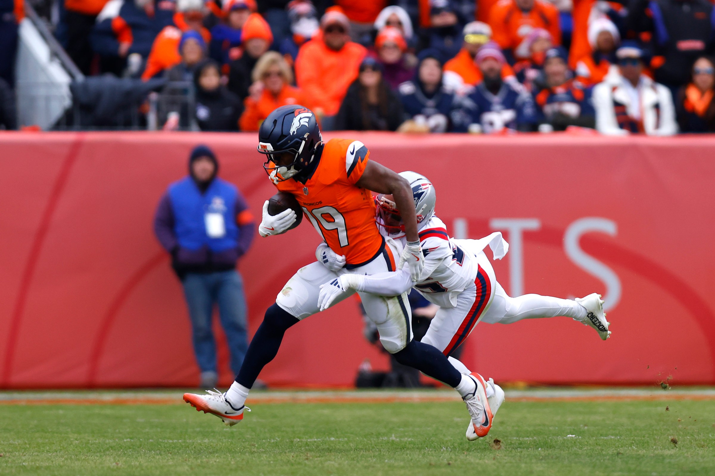 DENVER, COLORADO - JANUARY 25: Marvin Mims Jr. #19 of the Denver Broncos makes a catch against Marcus Jones #25 of the New England Patriots during the second quarter in the AFC Championship Playoff game at Empower Field At Mile High on January 25, 2026 in Denver, Colorado. (Photo by Justin Edmonds/Getty Images)