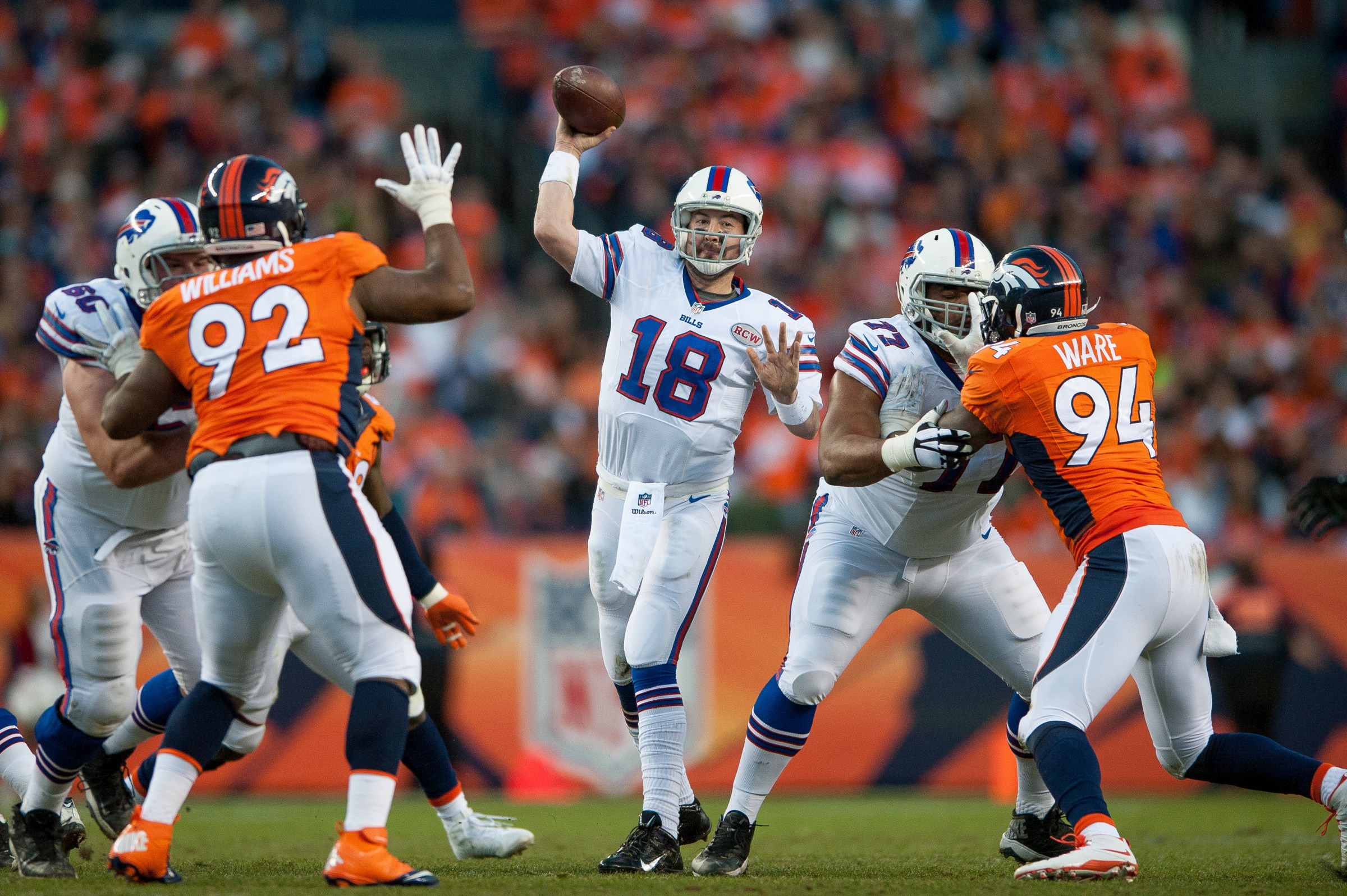 DENVER, CO - DECEMBER 7: Quarterback Kyle Orton #18 of the Buffalo Bills passes against the Denver Broncos during a game at Sports Authority Field at Mile High on December 7, 2014 in Denver, Colorado. (Photo by Dustin Bradford/Getty Images)