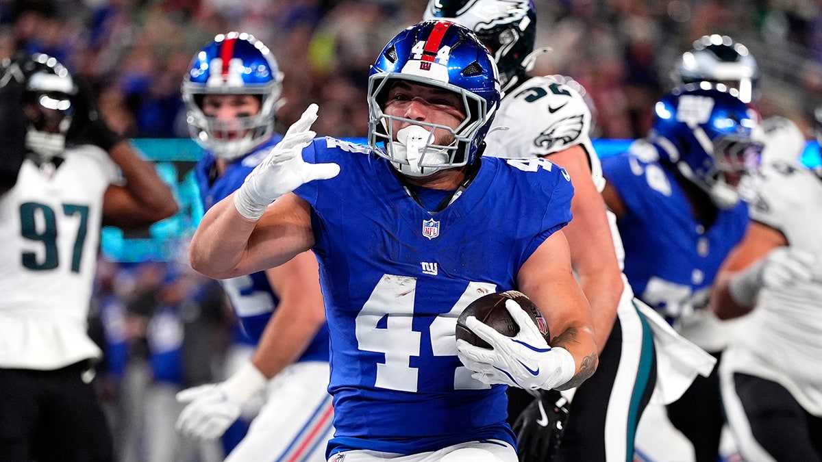 Cam Skattebo scores a touchdown