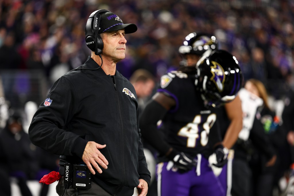 Baltimore Ravens head coach John Harbaugh on the sideline during a game.