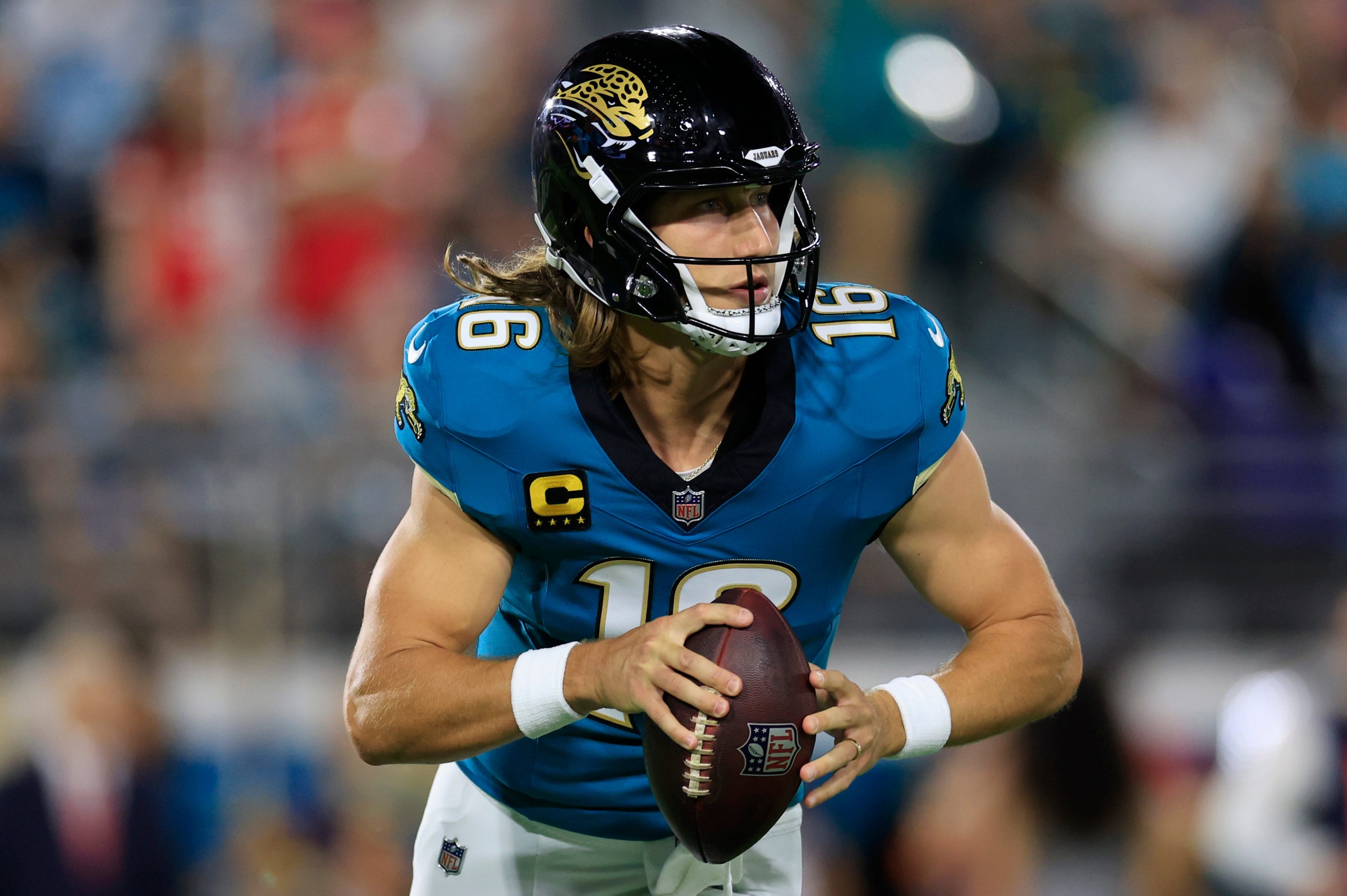 Jacksonville Jaguars quarterback Trevor Lawrence (16) rolls from the pocket during the first quarter of an NFL football matchup at EverBank Stadium, Monday, Oct. 6, 2025, in Jacksonville, Fla. The Jacksonville Jaguars edged the Kansas City Chiefs 31-28. [Corey Perrine/Florida Times-Union]