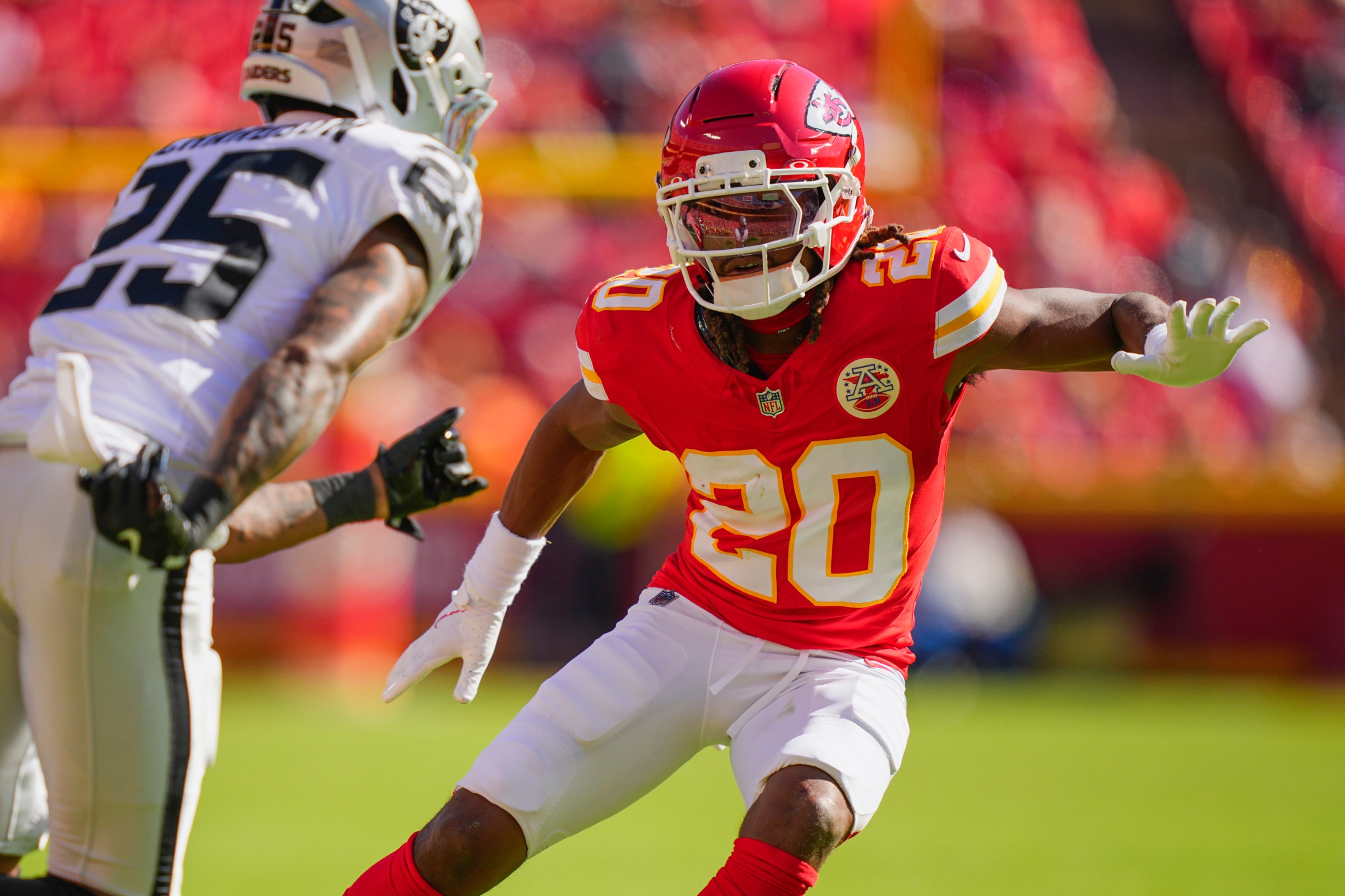 Oct 19, 2025; Kansas City, Missouri, USA; Kansas City Chiefs cornerback Nohl Williams (20) defends Las Vegas Raiders cornerback Decamerion Richardson (25) during the second half at GEHA Field at Arrowhead Stadium. Mandatory Credit: Jay Biggerstaff-Imagn Images