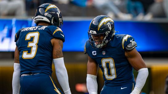 Los Angeles Chargers linebacker, Daiyan Henley (0) celebrates with teammate Derwin James Jr. during an NFL football game against the Las Vegas Raiders on November 30, 2025 in Los Angeles, CA.