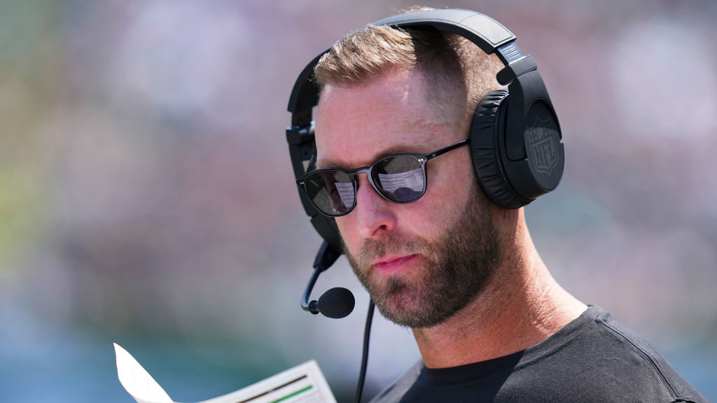 Washington Commanders OC Kliff Kingsbury looks at his play sheet....