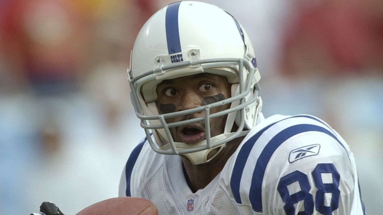 Indianapolis Colts wide receiver Marvin Harrison catches a 52-yard pass from Peyton Manning for a touchdown during the first quarter against the Kansas City Chiefs Sunday, Oct. 31, 2004, at Arrowhead Stadium in Kansas City, Mo. (AP Photo/Charlie Riedel)