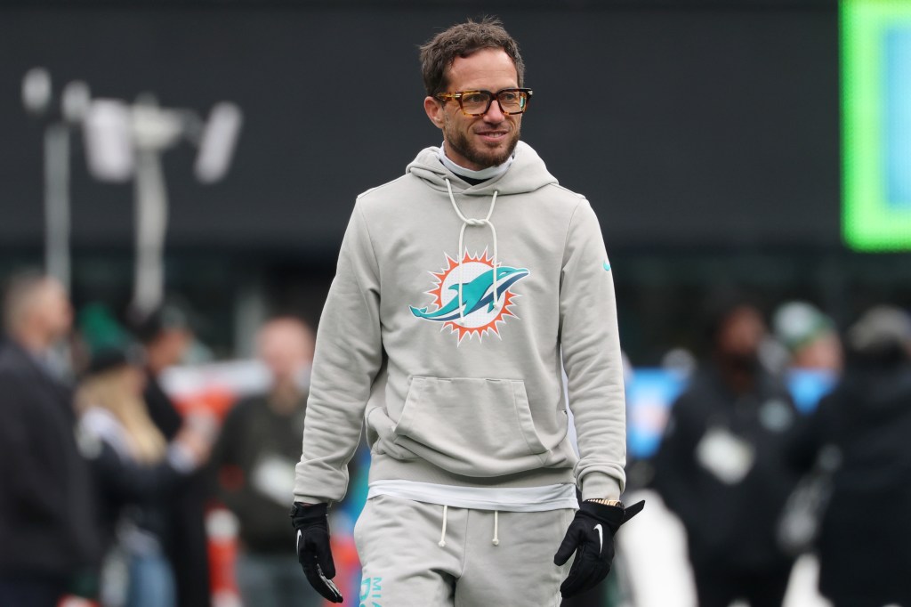 Miami Dolphins head coach Mike McDaniel in a grey hoodie with the team logo.