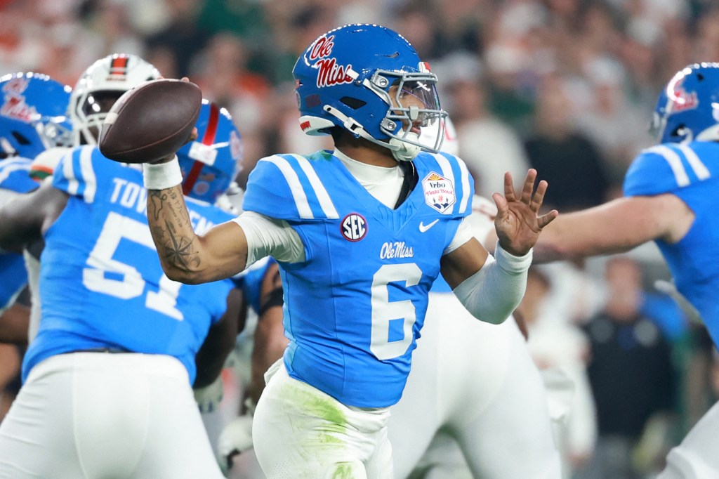 Mississippi Rebels quarterback Trinidad Chambliss (6) drops back to pass against the Miami Hurricanes in the first half during the 2026 Fiesta Bowl and semifinal game of the College Football Playoff at State Farm Stadium. 