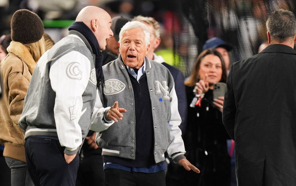 New England Patriots owner Robert Kraft speaks with FIFA President Gianni Infantino.