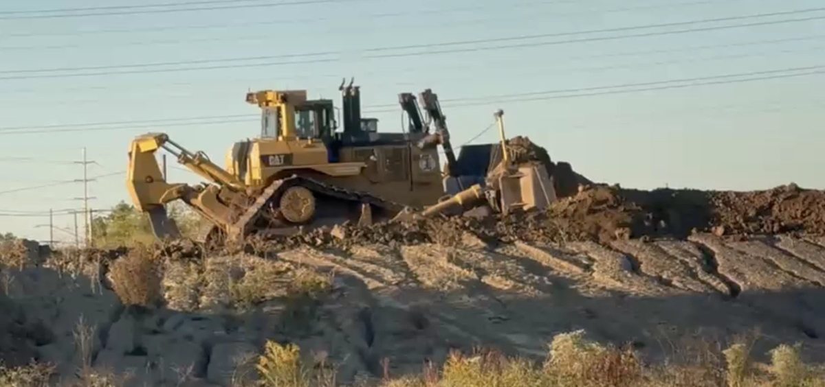 A bulldozer moves on a pile of dirt at the site of the new Browns