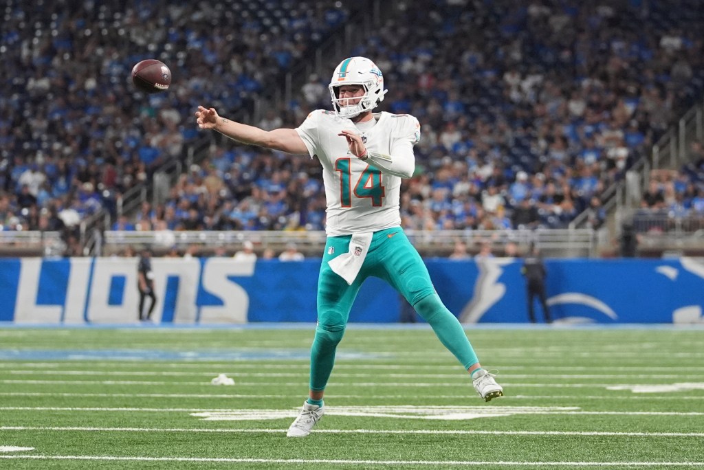 Miami Dolphins quarterback throwing a football.