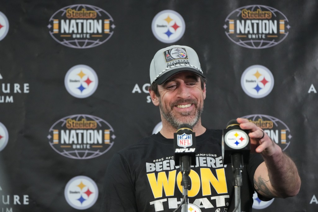 Pittsburgh Steelers quarterback Aaron Rodgers smiles while speaking during a news conference.