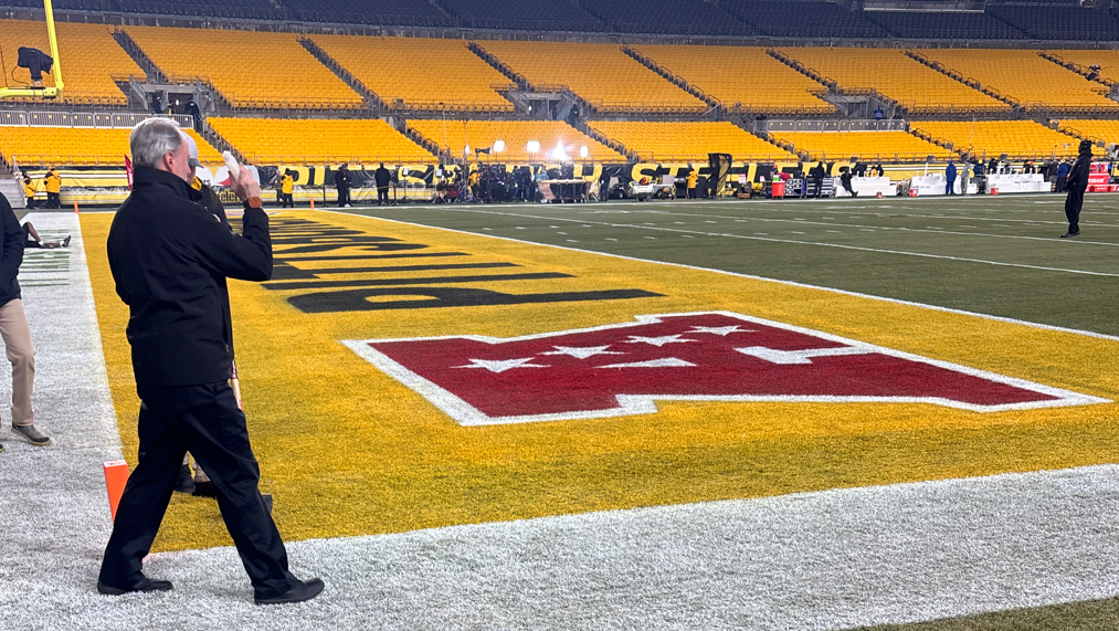 Priest sprinkles holy water on Steelers end zones before clincher
