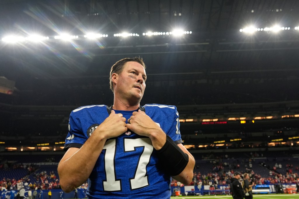 Philip Rivers on the field after an NFL football game.