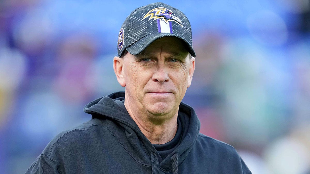 Todd Monken looks on