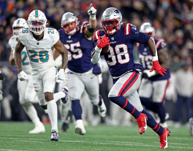 New England Patriots running back Rhamondre Stevenson runs up field during the third quarter of Sunday's win over the Dolphins at Gillette Stadium. (Nancy Lane/Boston Herald)