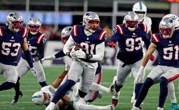 Foxboro, MA - New England Patriots linebacker Elijah Ponder recovers a fumble during the second quarter of the game at Gillette Stadium. (Nancy Lane/Boston Herald)