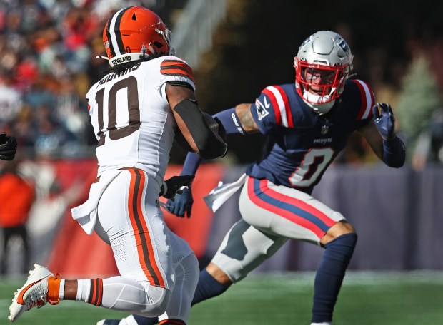 New England Patriots Christian Gonzalez chases down Cleveland Browns' Quinshon Judkins during the second quarter of a game at Gillette Stadium. (Nancy Lane/Boston Herald)