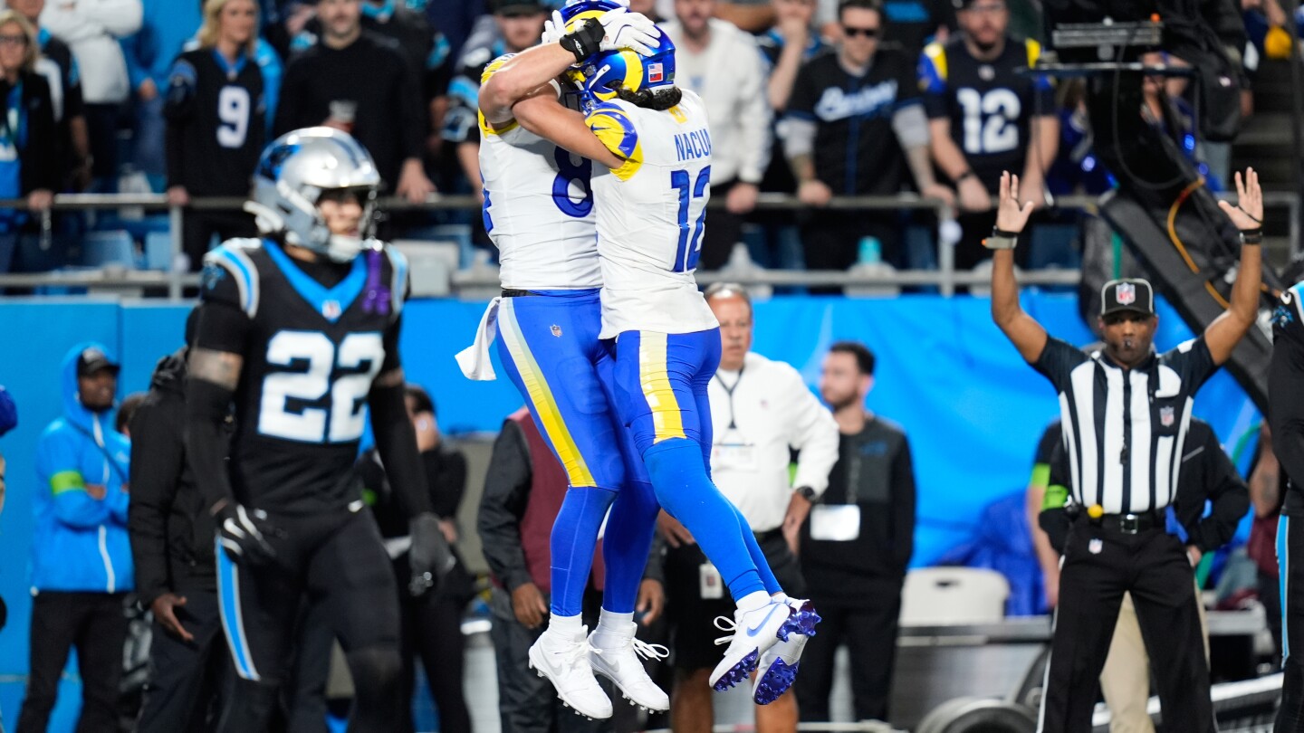Stafford's late TD pass to Parkinson lifts the Rams past the Panthers 34-31 in the wild-card round