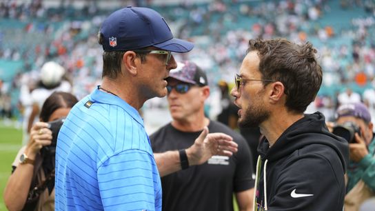 Oct 12, 2025; Miami Gardens, Florida, USA; Los Angeles Chargers head coach Jim Harbaugh greats Miami Dolphins Mike McDaniel at the game at Hard Rock Stadium.
