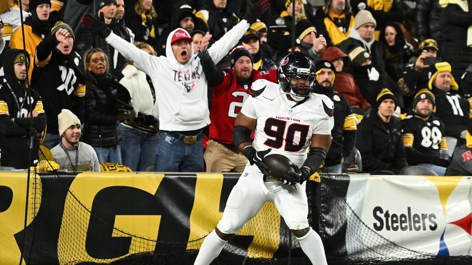 Texans secure first road playoff win with suffocating defensive performance