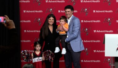 Zac Robinson joins his family at the podium as he is introduced as the Tampa Bay Buccaneers new offensive coordinator. (Michael Epps - Spectrum Sports 360)