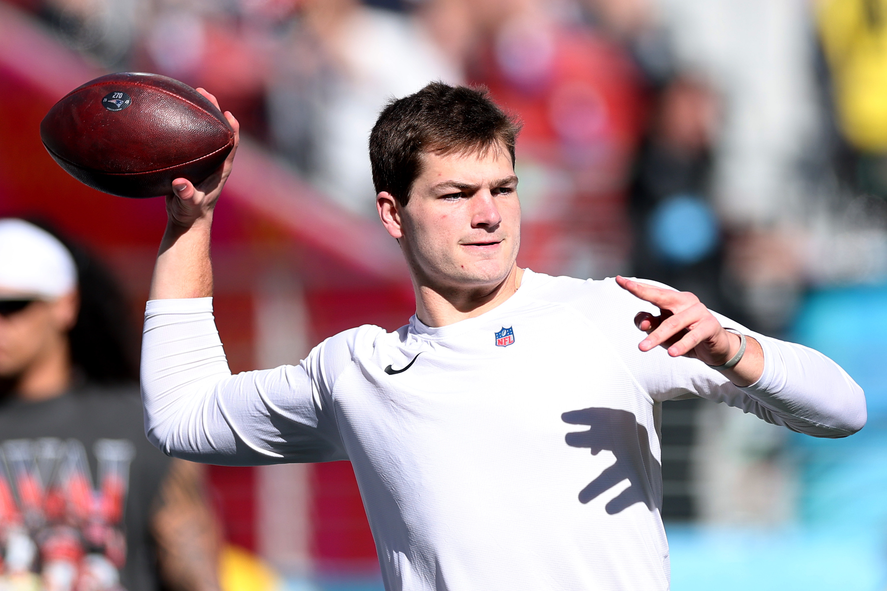 Drake Maye warming up prior to Super Bowl LX.