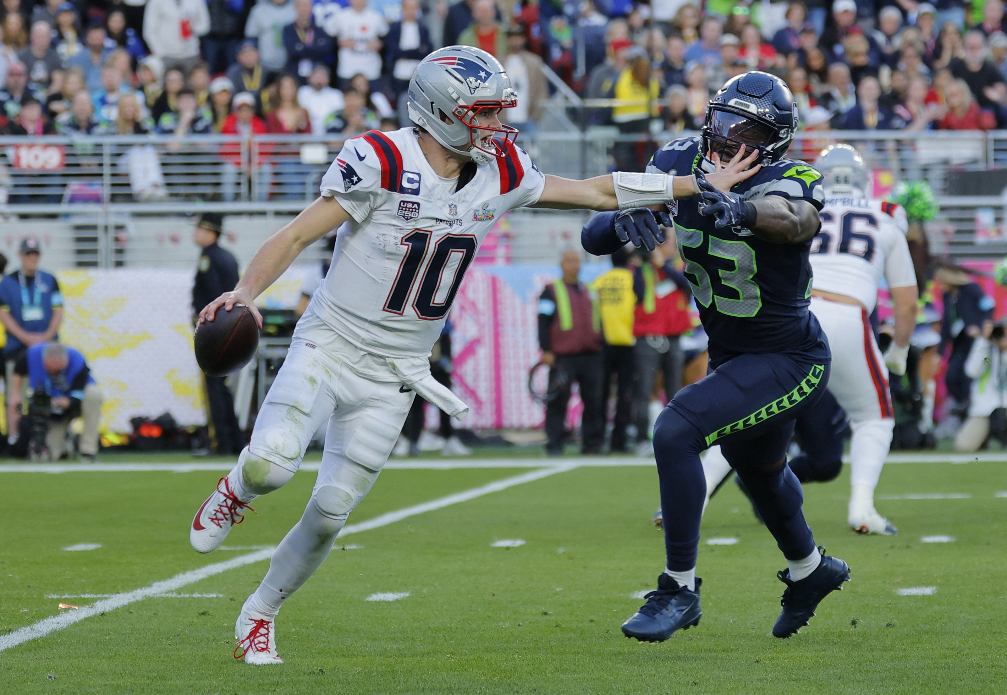 Drake Maye and Seahawks’ Boye Mafe (53)