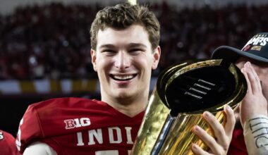Jan 19, 2026; Miami Gardens, FL, USA; Indiana Hoosiers quarterback Fernando Mendoza (16) celebrates with the trophy after defeating the Miami Hurricanes in the College Football Playoff National Championship game at Hard Rock Stadium. Mandatory Credit: Mark J. Rebilas-Imagn Images