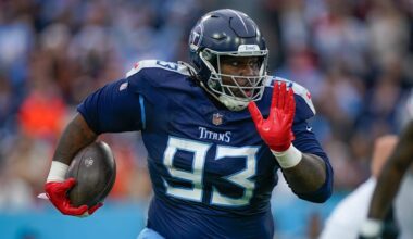 Tennessee Titans defensive tackle T'Vondre Sweat (93) returns the ball after stripping it from Cincinnati Bengals quarterback Joe Burrow (9) during the second quarter at Nissan Stadium in Nashville, Tenn., Sunday, Dec. 15, 2024.