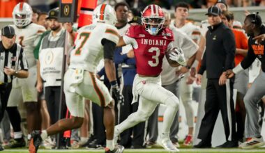 Indiana Hoosiers wide receiver Omar Cooper Jr. (3) runs down the sideline past Miami (FL) Hurricanes defenders Monday, Jan. 19, 2026, during the College Football Playoff National Championship college football game at Hard Rock Stadium in Miami Gardens.