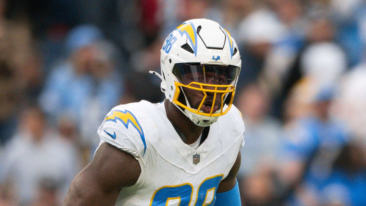 Nov 2, 2025; Nashville, Tennessee, USA;  Los Angeles Chargers linebacker Odafe Oweh (98) celebrates his sack with linebacker Tuli Tuipulotu (45) against the Tennessee Titans during the second half at Nissan Stadium. Mandatory Credit: Steve Roberts-Imagn Images