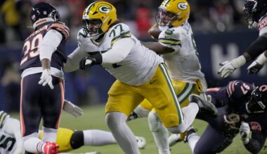 Green Bay Packers guard Jordan Morgan (77) clears the way for running back Josh Jacobs (8) during the second quarter of their wild card playoff game against the Chicago Bears Saturday, January 10, 2026 at Soldier Field in Chicago, Illinois.
