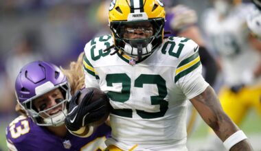 Green Bay Packers running back Emanuel Wilson (23) loses 18-yards on a run against the Minnesota Vikings during their football game Sunday, January 4, 2026, at U.S. Bank Stadium in Minneapolis, Minnesota.