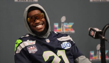 Seattle Seahawks cornerback Devon Witherspoon (21) talks to the media.