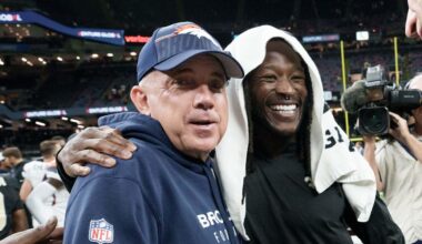 Denver Broncos head coach Sean Payton greets New Orleans Saints running back Alvin Kamara,