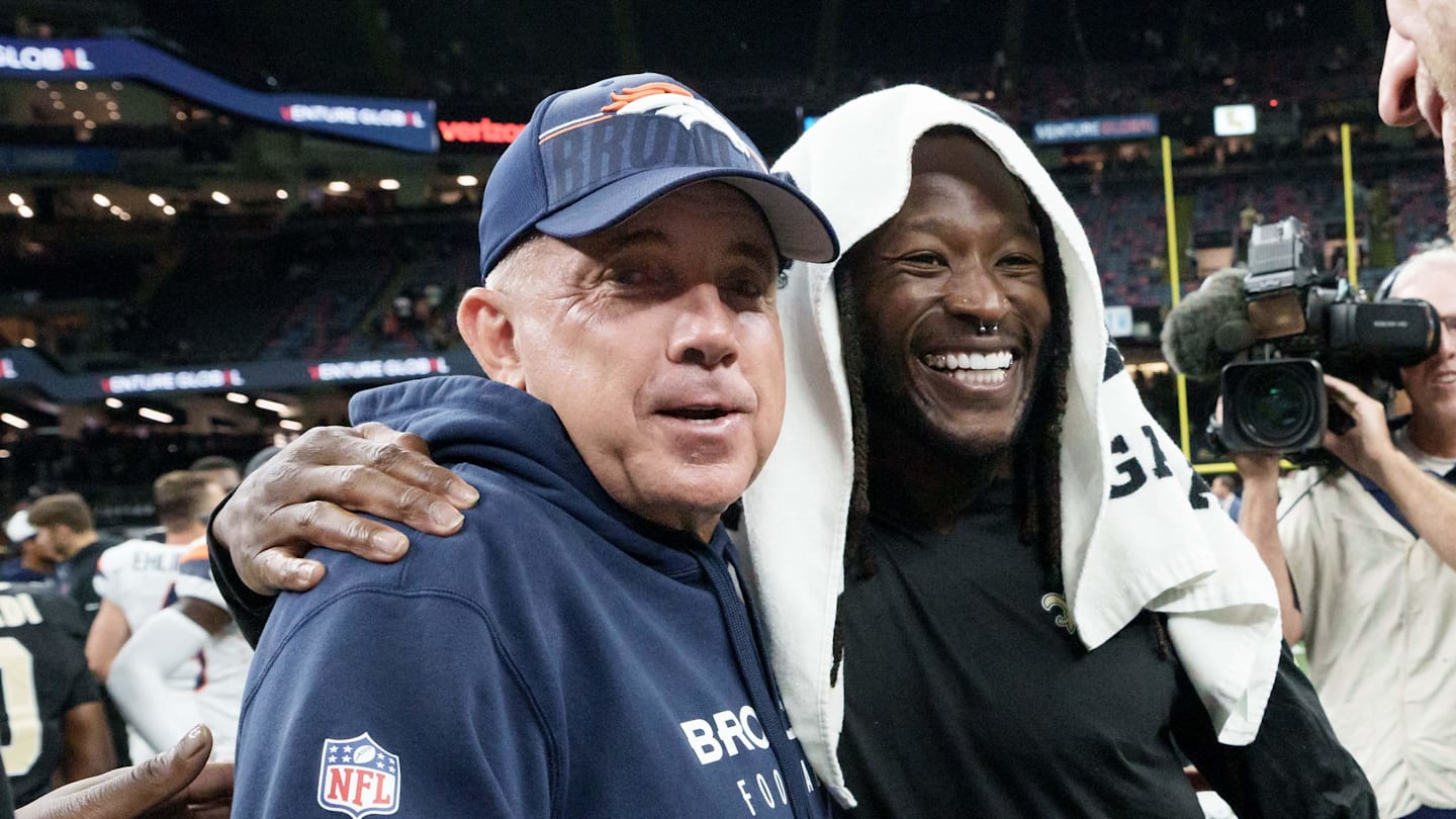 Denver Broncos head coach Sean Payton greets New Orleans Saints running back Alvin Kamara,
