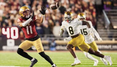 Nov 1, 2025; Chestnut Hill, Massachusetts, USA; Boston College Eagles wide receiver Lewis Bond (11) catches a pass against Notre Dame Fighting Irish safety Adon Shuler (8) in the fourth quarter at Alumni Stadium. Mandatory Credit: Edward Finan-Imagn Images