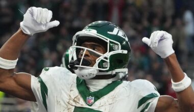 Oct 6, 2024; London, United Kingdom; New York Jets wide receiver Garrett Wilson (5) celebrates after scoring on a 1-yard touchdown reception against the New York Jets in the fourth quarter at Tottenham Hotspur Stadium. Mandatory Credit: Kirby Lee-Imagn Images