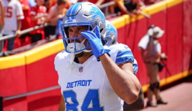 Detroit Lions tight end Shane Zylstra (84) enters the field for warm ups against the Kansas City Chiefs prior to the game at GEHA Field at Arrowhead Stadium.