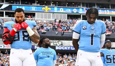 Dec 28, 2025; Nashville, Tennessee, USA;  Tennessee Titans defensive tackle Jeffery Simmons (98) and quarterback Cameron Ward (1) stand during the National Anthem against the New Orleans Saints during the first half at Nissan Stadium. Mandatory Credit: Steve Roberts-Imagn Images