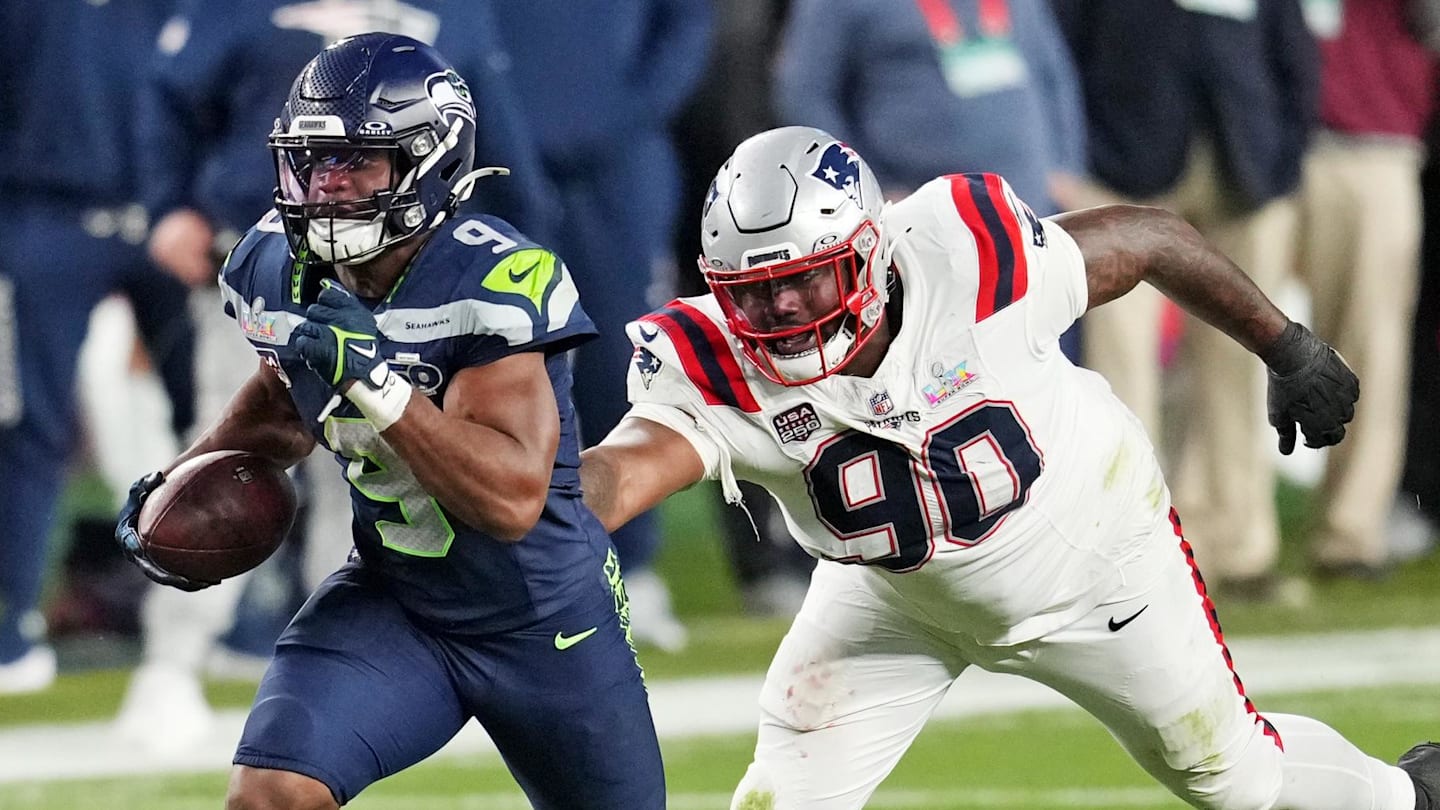 Feb 8, 2026; Santa Clara, CA, USA; Seattle Seahawks running back Kenneth Walker III (9) runs the ball as New England Patriots defensive tackle Christian Barmore (90) defends during the third quarter in Super Bowl LX at Levi's Stadium. Mandatory Credit: Cary Edmondson-Imagn Images